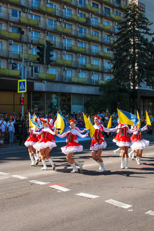 Dnipro, Ukraine - 09.11.2021: Citizens celebrate City Day. Girls dancers with waving flags of Ukraine.のeditorial素材