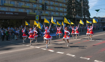 Dnipro, Ukraine - 09.11.2021: Citizens celebrate City Day. Girls dancers with waving flags of Ukraine.のeditorial素材
