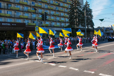 Dnipro, Ukraine - 09.11.2021: Citizens celebrate City Day. Girls dancers with waving flags of Ukraine.のeditorial素材