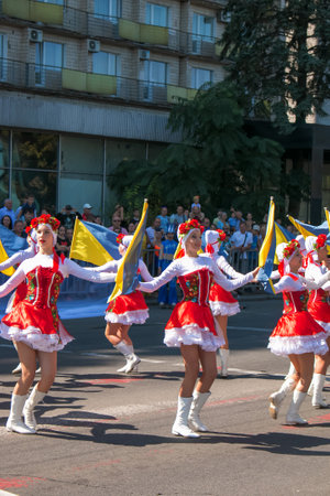 Dnipro, Ukraine - 09.11.2021: Citizens celebrate City Day. Girls dancers with waving flags of Ukraine.のeditorial素材