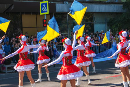 Dnipro, Ukraine - 09.11.2021: Citizens celebrate City Day. Girls dancers with waving flags of Ukraine.のeditorial素材