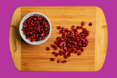 Background of fresh pomegranate seeds. Healthy food concept.の写真素材