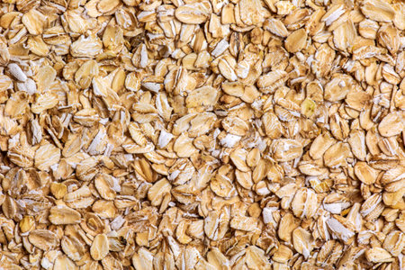 Rolled oat, oat flakes background or texture. close up. food concept. Healthy and wholesome food.の写真素材
