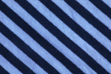 Marine textile texture for background. Close-up of a marine textile texture with blue and white...