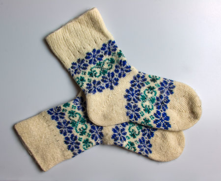 White wool socks with blue-green handmade Argentine merino wool on a white background.の写真素材