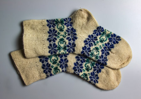 White wool socks with blue-green handmade Argentine merino wool on a white background.の写真素材