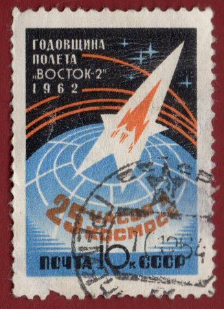USSR - CIRCA 1962: Postcard printed in the USSR shows anniversary of flight VOSTOK-2, circa 1962のeditorial素材