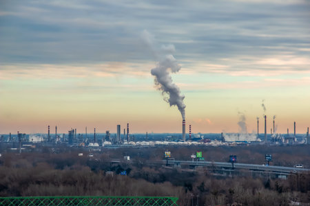 Bratislava, Slovakia - 07/01/2023: View of the oil refinery. Smoke pollution, exhaust gases. climate change, ecologyのeditorial素材