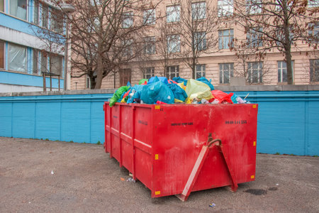Slovakia, Bratislava - 08/01/2023: Container with garbage on the city street. Ecology concept.のeditorial素材
