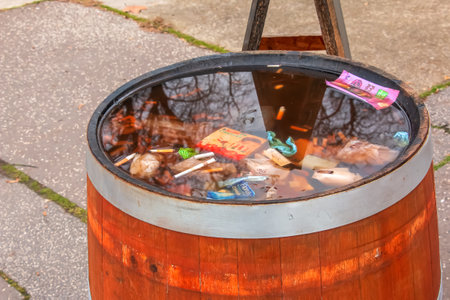 Slovakia, Bratislava - 08/01/2023: Container with garbage on the city street. Ecology concept.のeditorial素材