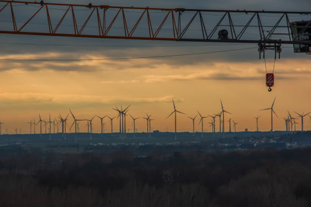 Wind farm or wind farm at sunset in cloudy weather in Austria in Europe, allows you to get clean energy. It's sustainable, renewable energy for the environmentの写真素材