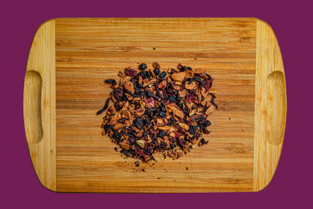 Background of natural fruit tea with hibiscus petals, fruit slices and berries. fruit tea texture. Top view, flat lay.の写真素材
