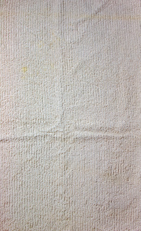 The texture of a light beige bath towel with a large volumeの写真素材