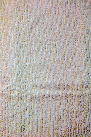 The texture of a light beige bath towel with a large volumeの写真素材