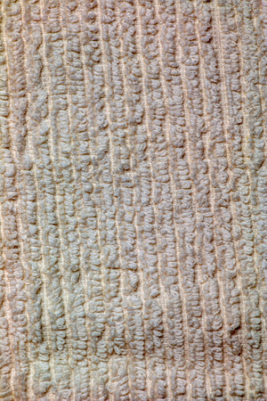 The texture of a light beige bath towel with a large volumeの写真素材