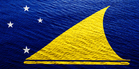 Flag of Tokelau on a textured background. concept collage.の写真素材