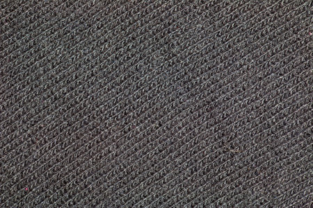Black knitted fabric texture. Abstract modern Knit texture black color. Dark knitted backgroundの写真素材