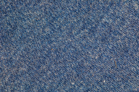 Texture of blue knitted fabric. Abstract modern knitted texture in blue color. Dark knitted backgroundの写真素材