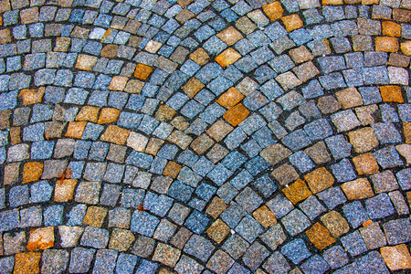 Background of stone pavement. Pavement made of grit stone blocks.の写真素材