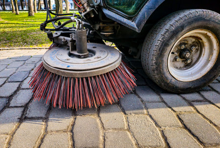 Close-up sweeper machine cleaning. Concept clean streets from debris.の写真素材