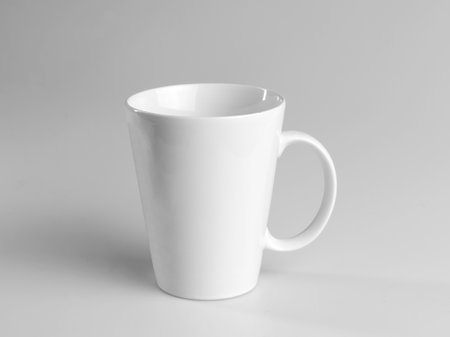 White mug on a gray background. side view.の写真素材