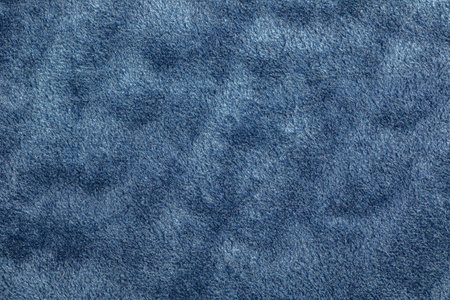 Blue, textured and fleecy fabric in soft carpet and velor for the exterior of furniture. Blank homogeneous material texture and background blank. copyspace.の写真素材