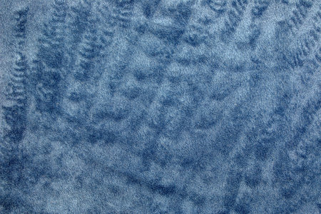 Blue, textured and fleecy fabric in soft carpet and velor for the exterior of furniture. Blank homogeneous material texture and background blank. copyspace.の写真素材