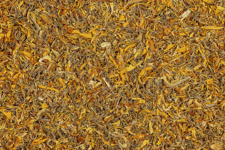 Illustration of background of dry herb CALENDULAE FLORES or Marigold petals used in herbal medicine. The concept of herbal treatment. Active ingredient CALENDULA OFFICINALISの写真素材