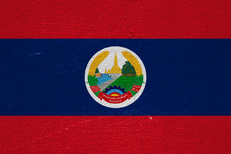 Lao People's Democratic Republic flag on a textured background. concept collage.の写真素材