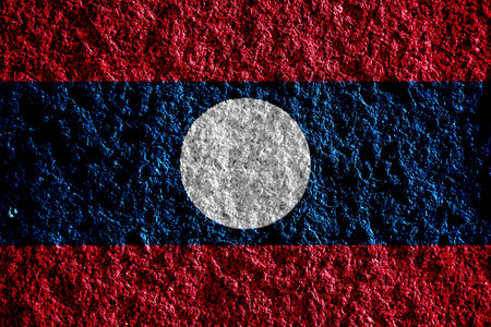 Lao People's Democratic Republic flag on a textured background. concept collage.の写真素材