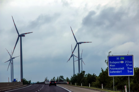 Wind farm or windmill in cloudy weather in Austria in Europe, allows you to get clean energy. It's sustainable, renewable energy for the environmentの写真素材
