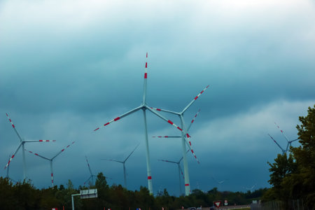 Wind farm or windmill in cloudy weather in Austria in Europe, allows you to get clean energy. It's sustainable, renewable energy for the environmentの写真素材