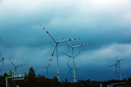 Wind farm or windmill in cloudy weather in Austria in Europe, allows you to get clean energy. It's sustainable, renewable energy for the environmentの写真素材