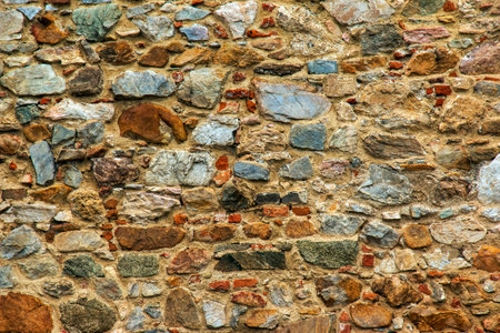 The texture of the stone wall. Background texture of the stone wall of the old castle. Stone wall as background or texture.の写真素材