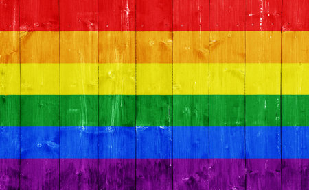 Flag of the LGBT community on the background of the wooden texture of the boards. Rainbow gay culture symbol. concept collage. Illustration symbol of pride.の写真素材