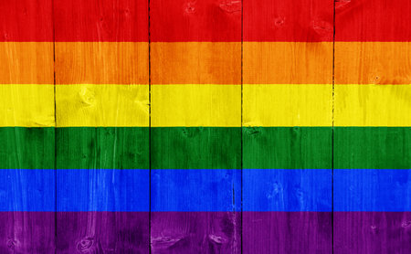 Flag of the LGBT community on the background of the wooden texture of the boards. Rainbow gay culture symbol. concept collage. Illustration symbol of pride.の写真素材