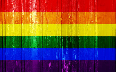 Flag of the LGBT community on the background of the wooden texture of the boards. Rainbow gay culture symbol. concept collage. Illustration symbol of pride.の写真素材