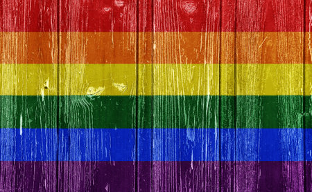 Flag of the LGBT community on the background of the wooden texture of the boards. Rainbow gay culture symbol. concept collage. Illustration symbol of pride.の写真素材
