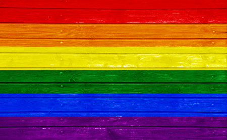 Flag of the LGBT community on the background of the wooden texture of the boards. Rainbow gay culture symbol. concept collage. Illustration symbol of pride.の写真素材