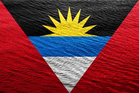 Flag of Antigua and Barbuda on a textured background. concept collage.の写真素材