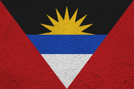 Flag of Antigua and Barbuda on a textured background. concept collage.の写真素材