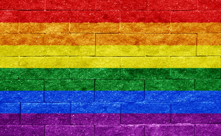 Flag of the LGBT community on the background of a stone wall. Rainbow symbol of gay culture. concept collage. Illustration symbol of pride.の写真素材