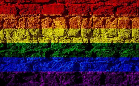 Flag of the LGBT community on the background of a stone wall. Rainbow symbol of gay culture. concept collage. Illustration symbol of pride.の写真素材