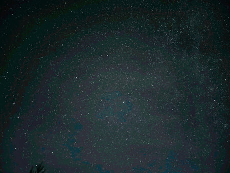 Astrophoto taken with the Galaxy S23 Ultra. The starry sky and the Milky Way galaxy are visible in the countryside at night.の写真素材