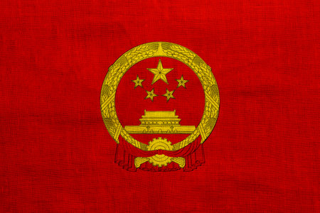 Flag and coat of arms of the People's Republic of China on a textured background. concept collage.の写真素材