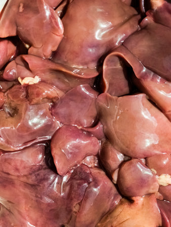 Fresh raw chicken liver closeup as background. cooking food.の写真素材