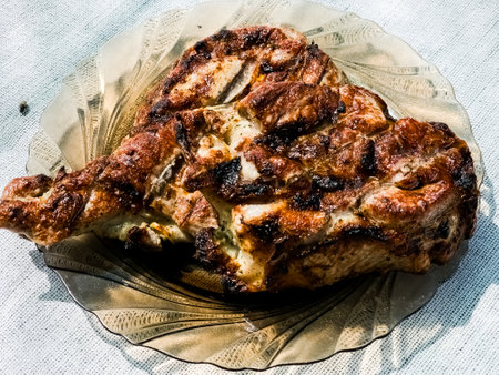 Freshly grilled piece of marinated pork neck on a plate.の写真素材