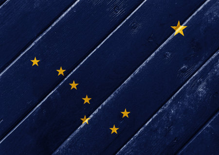 Flag of USA state Alaska on a textured background. concept collage.の写真素材