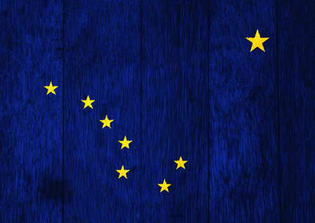 Flag of USA state Alaska on a textured background. concept collage.の写真素材