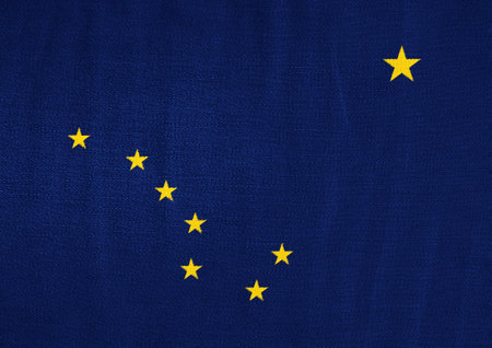 Flag of USA state Alaska on a textured background. concept collage.